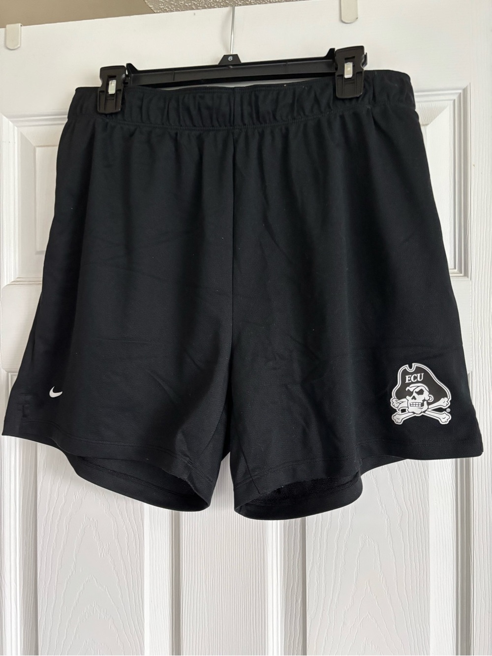 Like new Nike Women’s Black Athletic Shorts with ECU Pirate Logo. Sz L.
